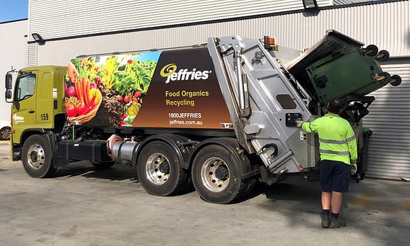 Jeffrie’s organics recycling truck collecting organic waste that will be turned into compost.