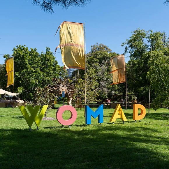 WOMAD in big, colourful letters in front of the festival’s entrance.
